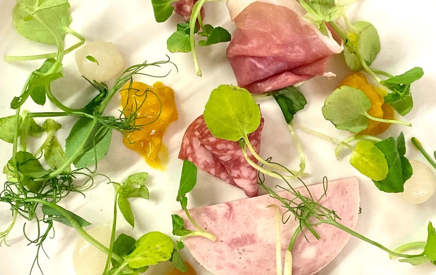 Pea shoot, salami and ham salad with piccalilli dressing