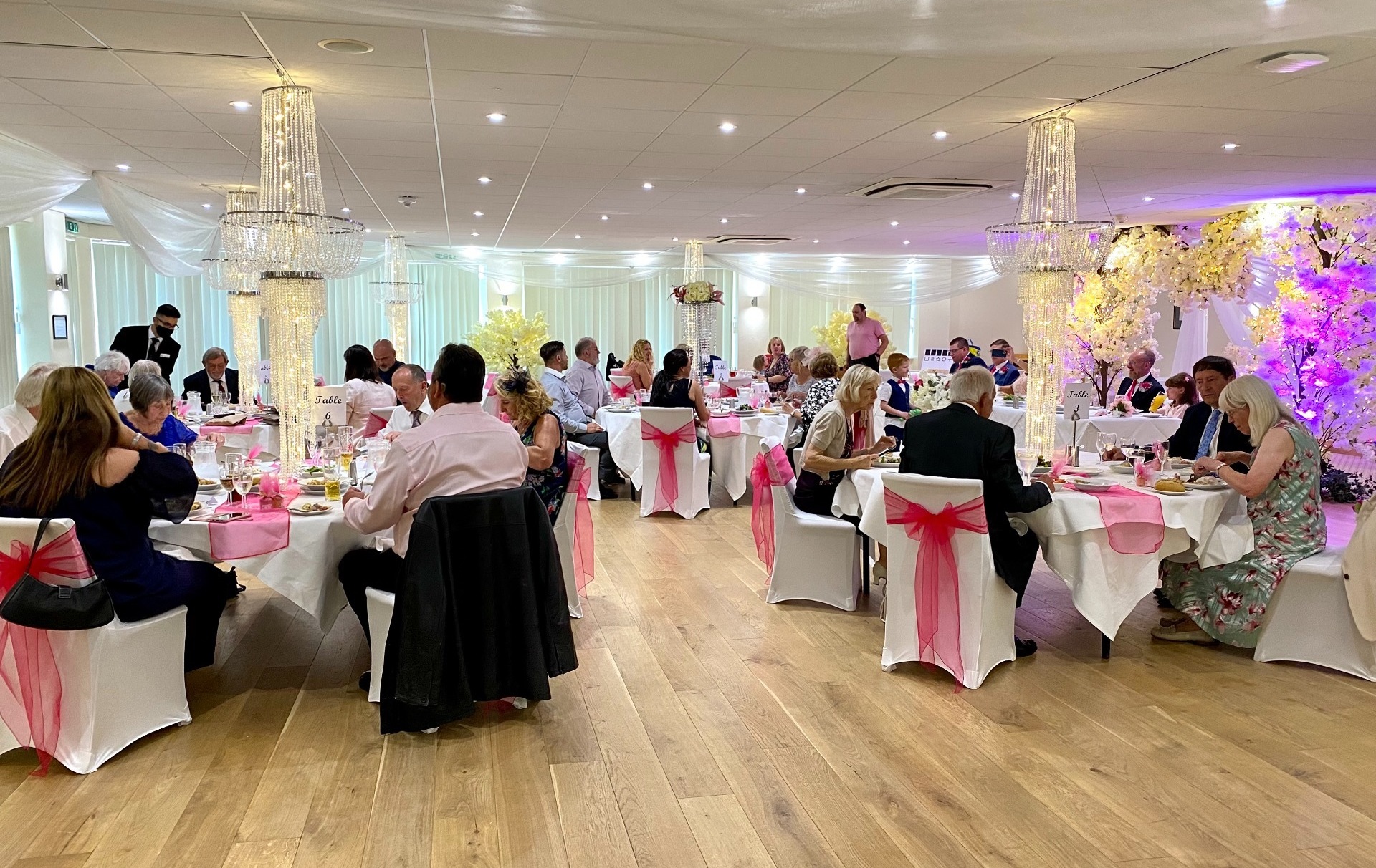 Wedding party in full swing with pink decorations